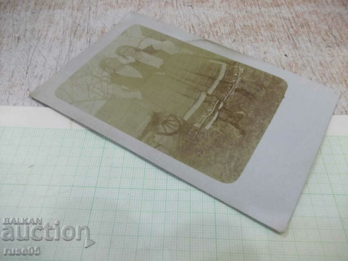 Auction Old photo of two women in costumes next to the cart Auction Old photo of two women in costumes next to the cart