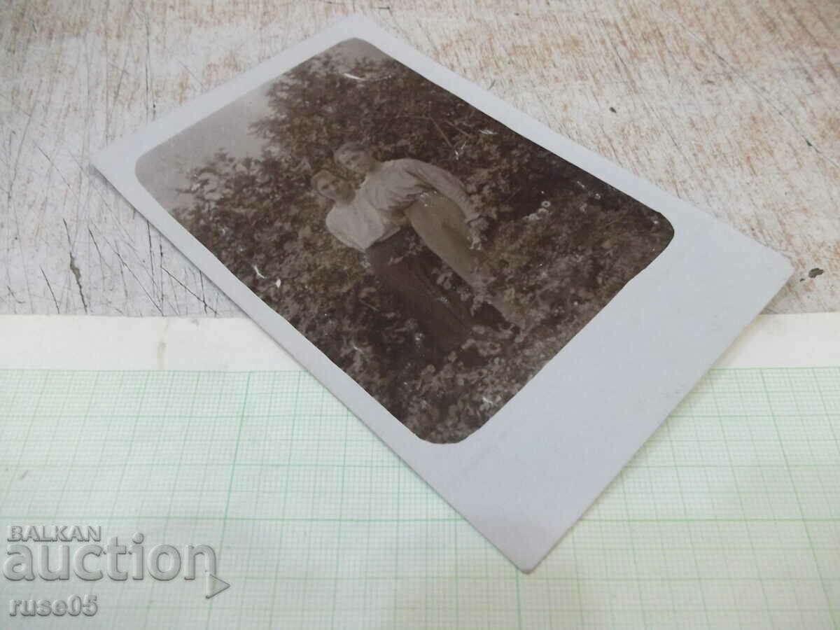 Delivery of Old photo of two women in front of bushes Delivery of Old photo of two women in front of bushes