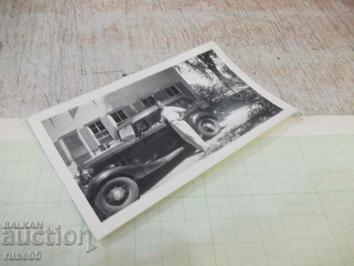 Auction Old photo of a man in front of a house next to a car Auction Old photo of a man in front of a house next to a car