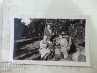 Old photo of three women in the orchard