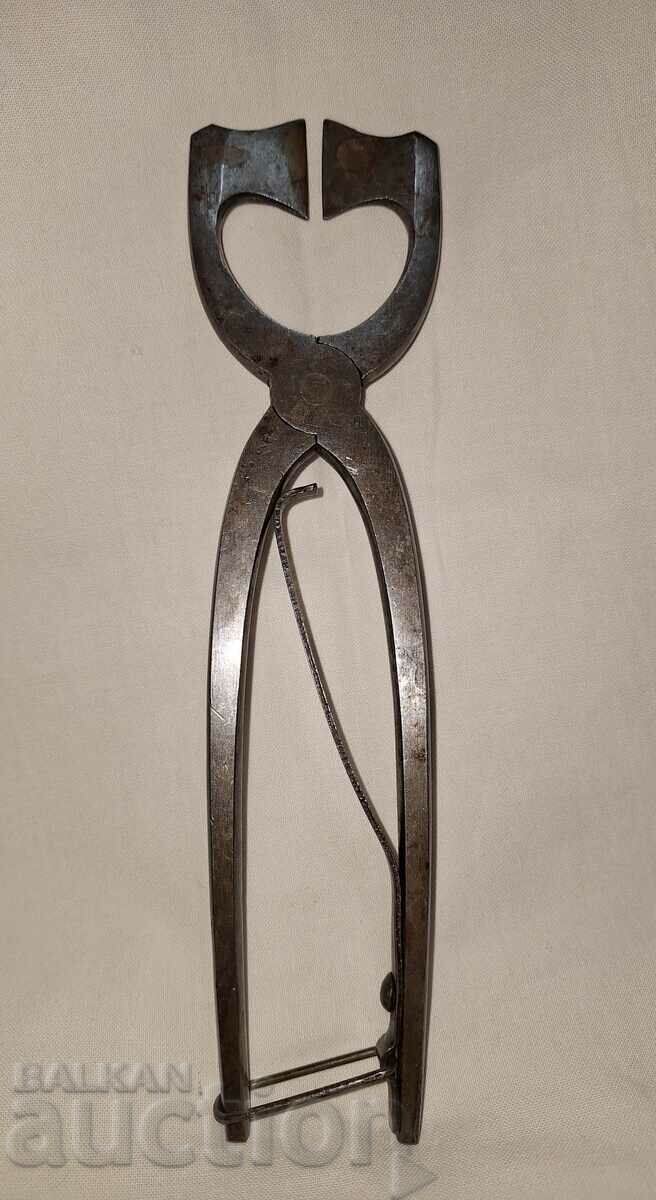 An old tool for cutting sugar An old tool for cutting sugar