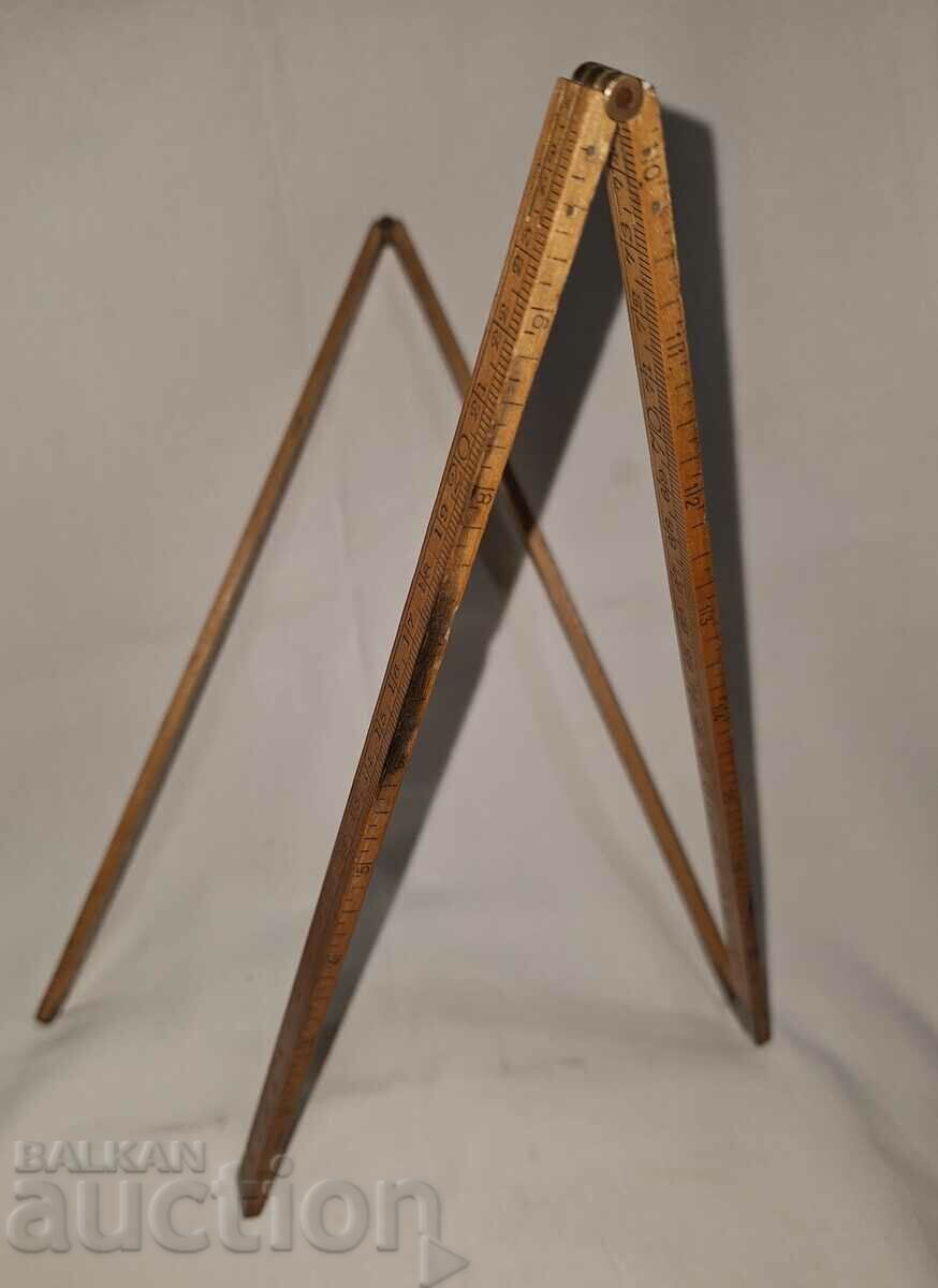 Old folding tape measure--100 cm.--wood bronze Old folding tape measure--100 cm.--wood bronze