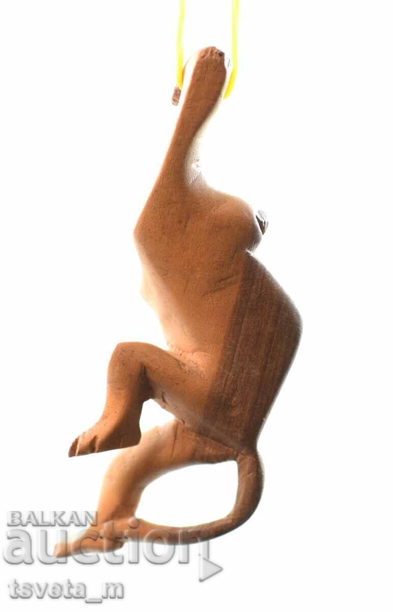 Auction  Handmade wooden hanging monkey figure, Africa