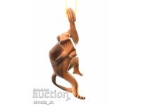 Handmade wooden hanging monkey figure, Africa