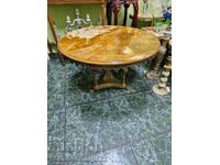 A lovely antique bronze table with an onyx top