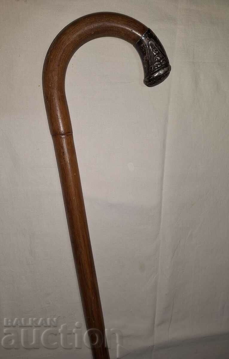 Cane with metal tip decoration