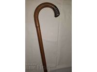 Cane with metal tip decoration