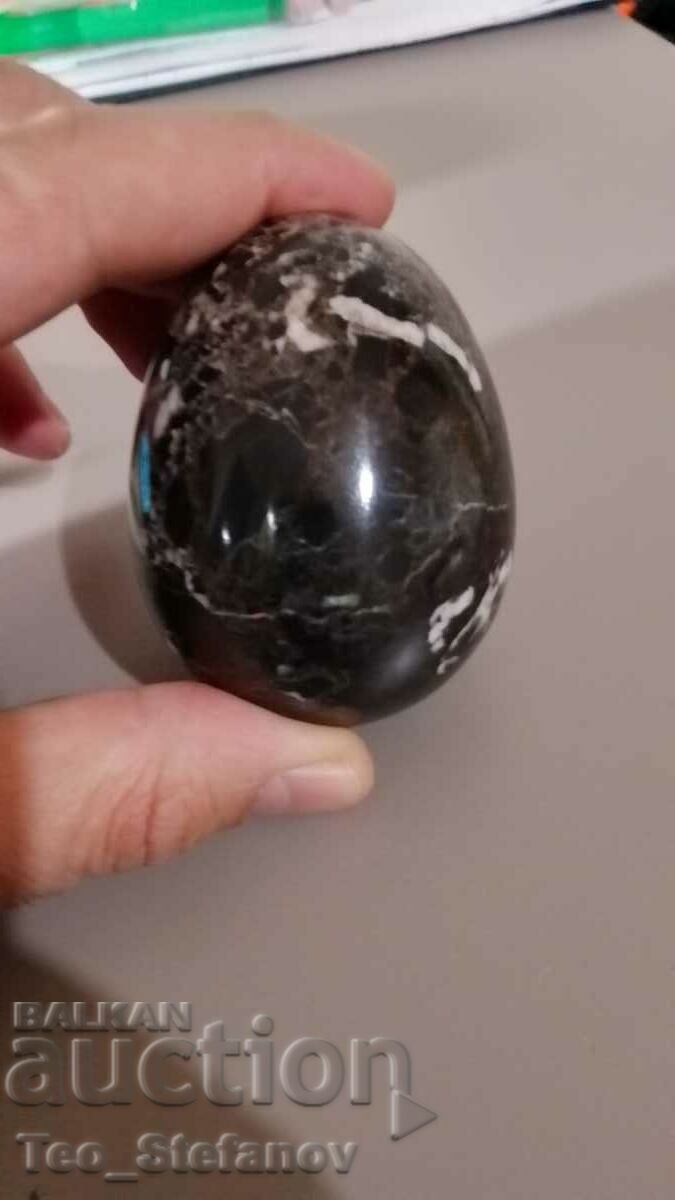 A large egg made of natural stone - marble