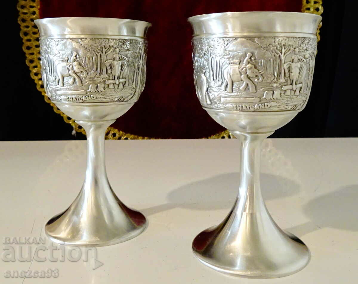 Two glasses on a pewter stool with an Elephant.