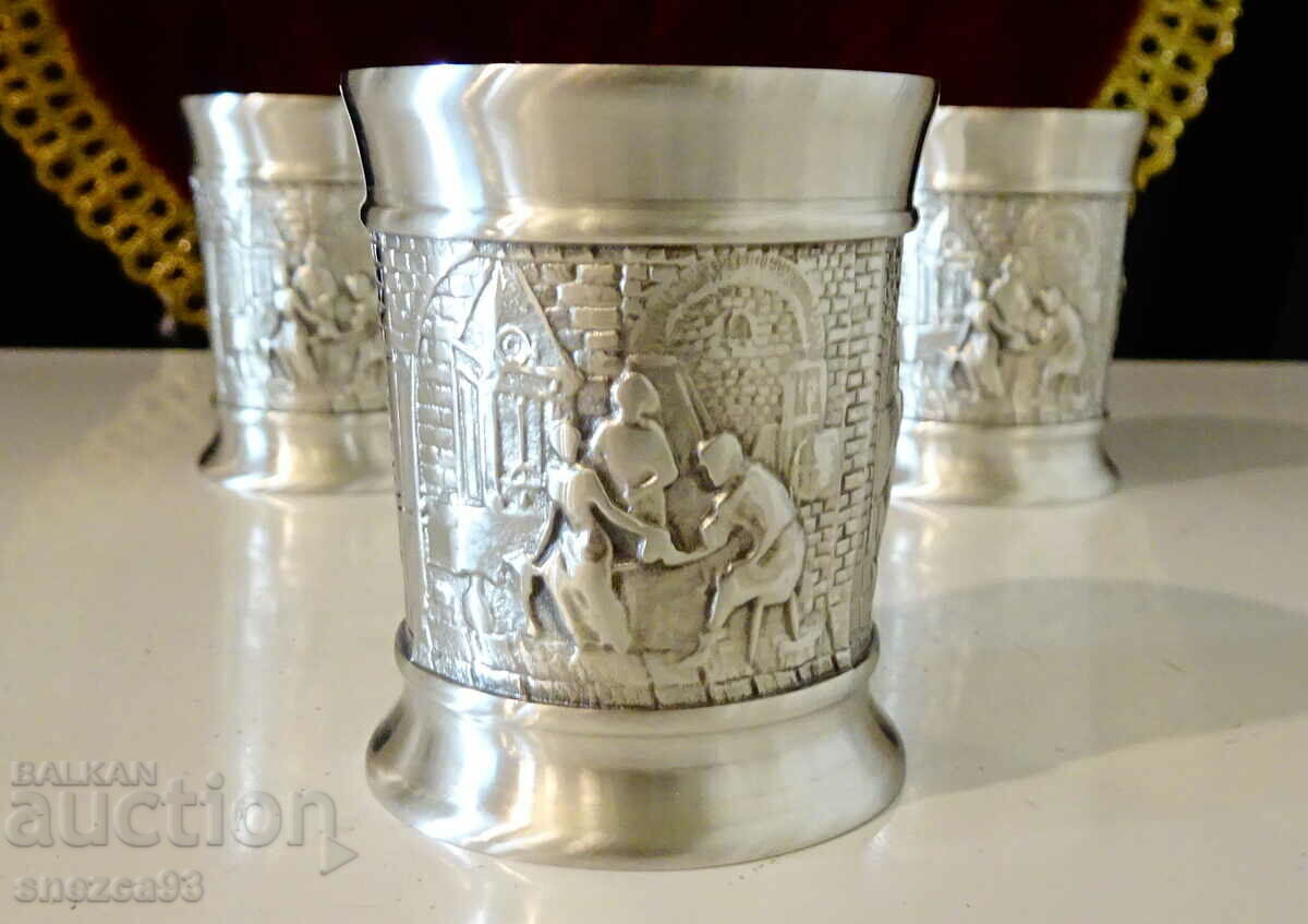 Three pewter cups with relief pictures Wedding. Three pewter cups with relief pictures Wedding.