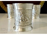 Three pewter cups with relief pictures Wedding.