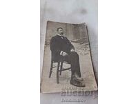 Photo Veleso Man with a mustache sitting on a wooden chair 1917