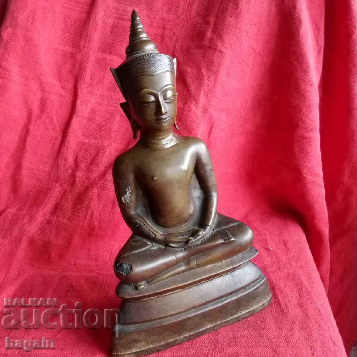 Bronze statue of Buddha. Gilding.