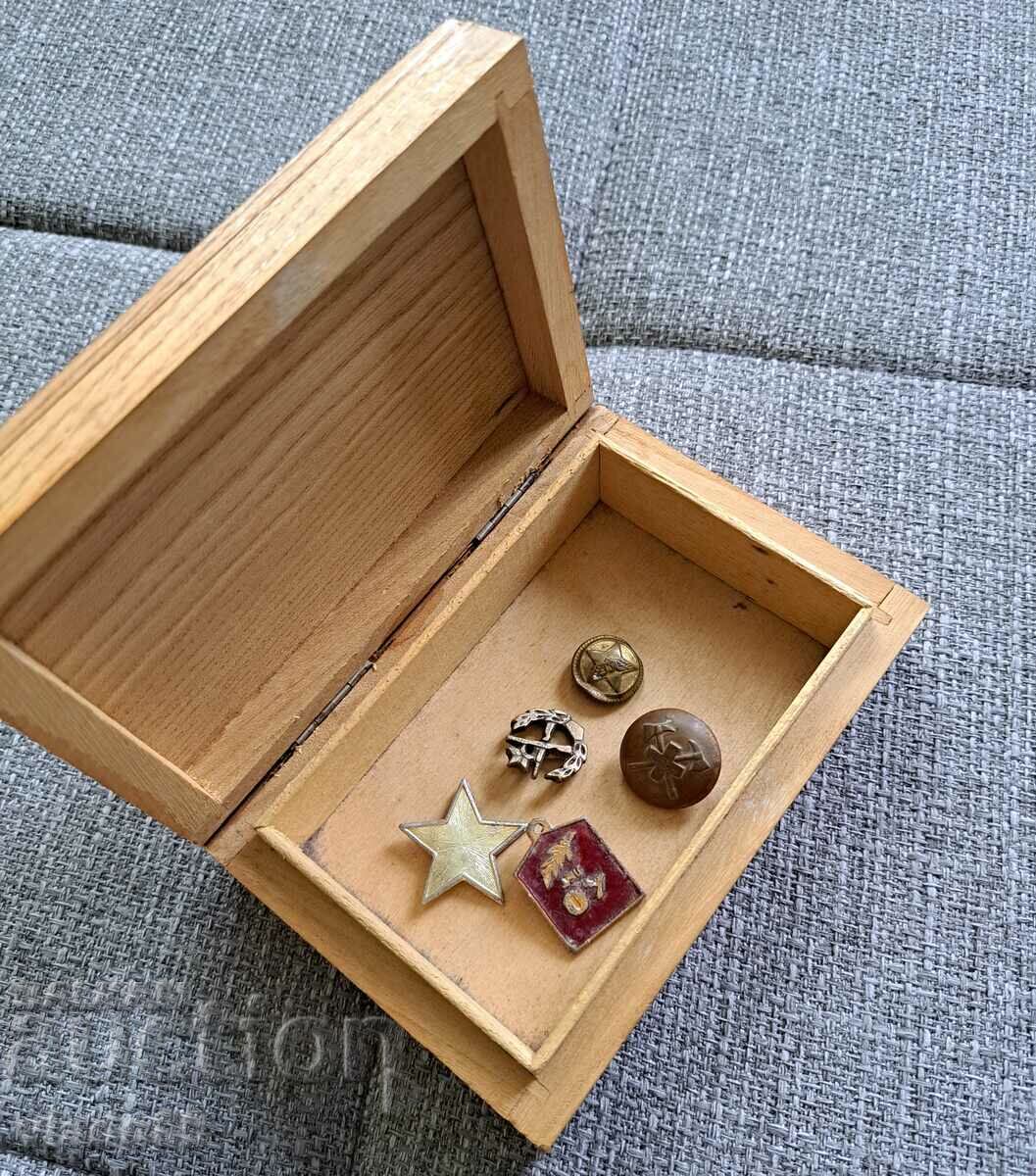 Wooden box with old badges and buttons