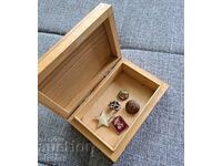 Wooden box with old badges and buttons