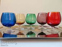 5 pcs. colored glass glasses on an aperitif chair