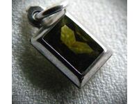 Silver locket with chrysolite