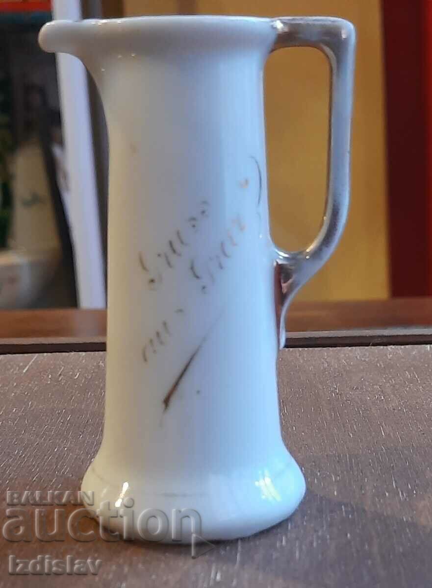 A small porcelain jug A small porcelain jug