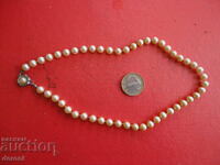 A great pearl and silver necklace