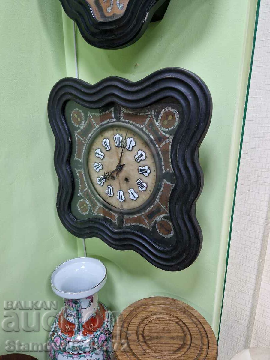 A beautiful antique French wall clock from the 19th century A beautiful antique French wall clock from the 19th century