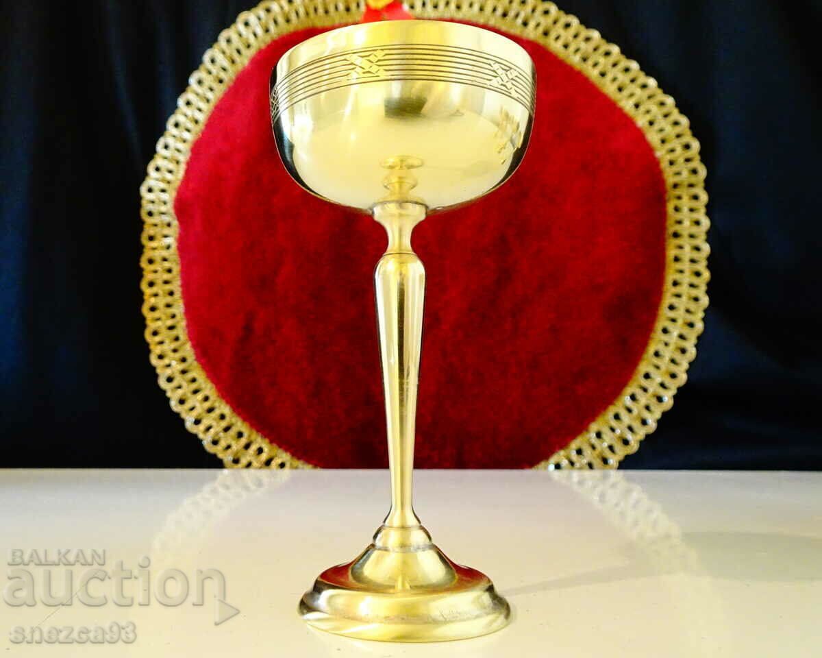 Auction Tall bronze glass for brandy, relief. Auction Tall bronze glass for brandy, relief.