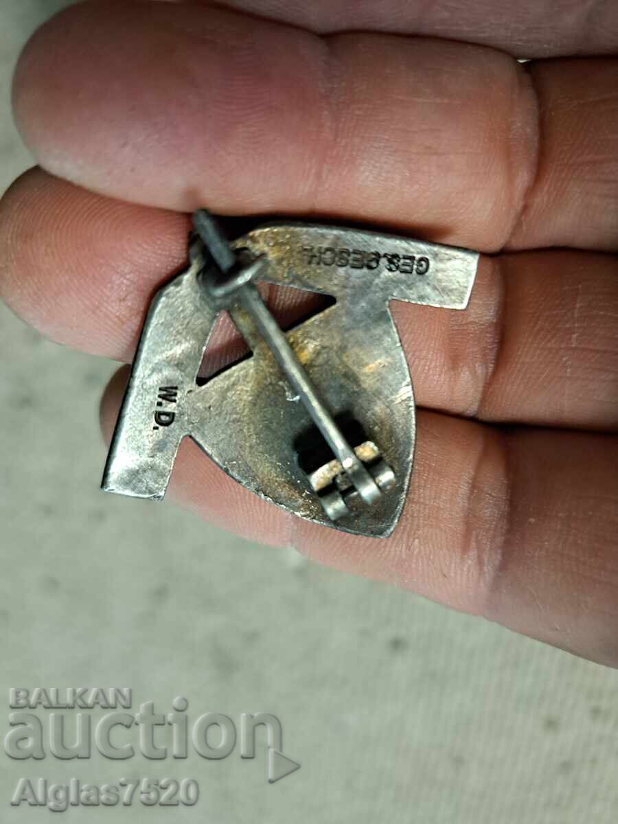 Auction Silver-plated Wehrmacht badge with swastika Auction Silver-plated Wehrmacht badge with swastika