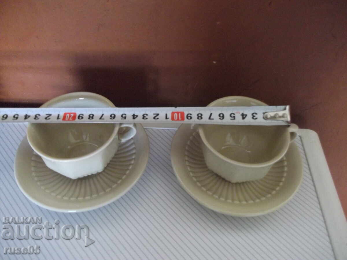 Delivery of Lot of 2 pcs. cups and 5 pcs. porcelain coffee saucers Delivery of Lot of 2 pcs. cups and 5 pcs. porcelain coffee saucers