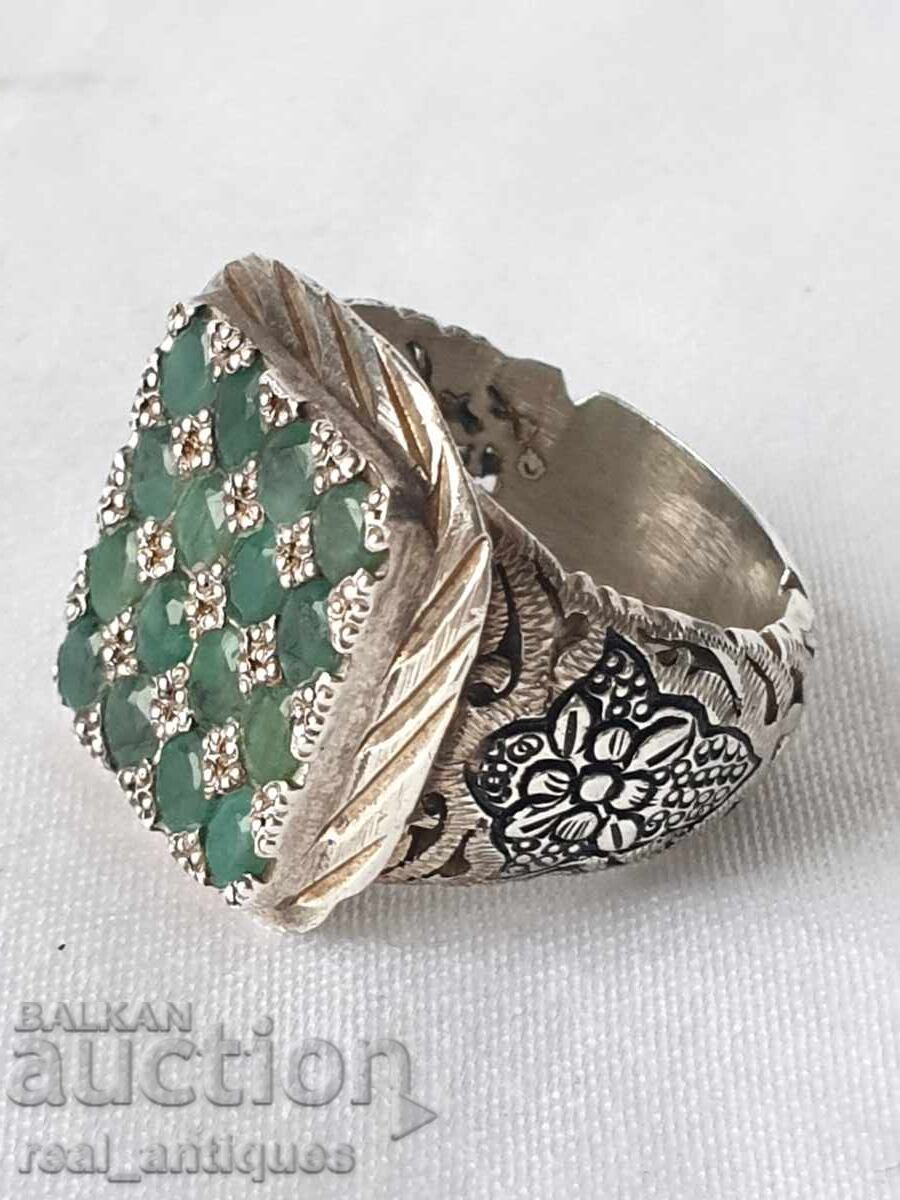 Silver ring with emeralds