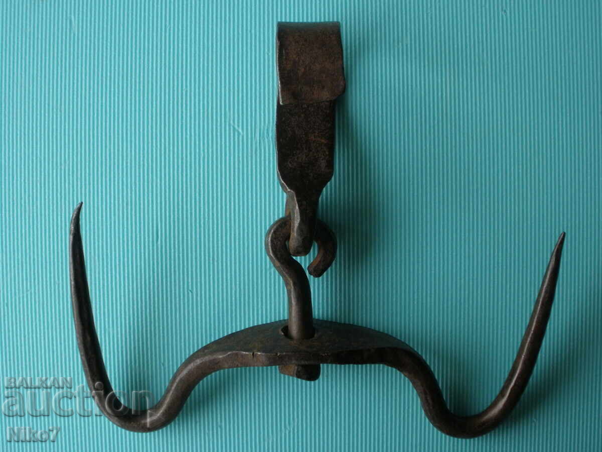 Delivery of Antique, large, massive, hand-forged double-clasp hook.