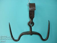 Antique, large, massive, hand-forged double-clasp hook.