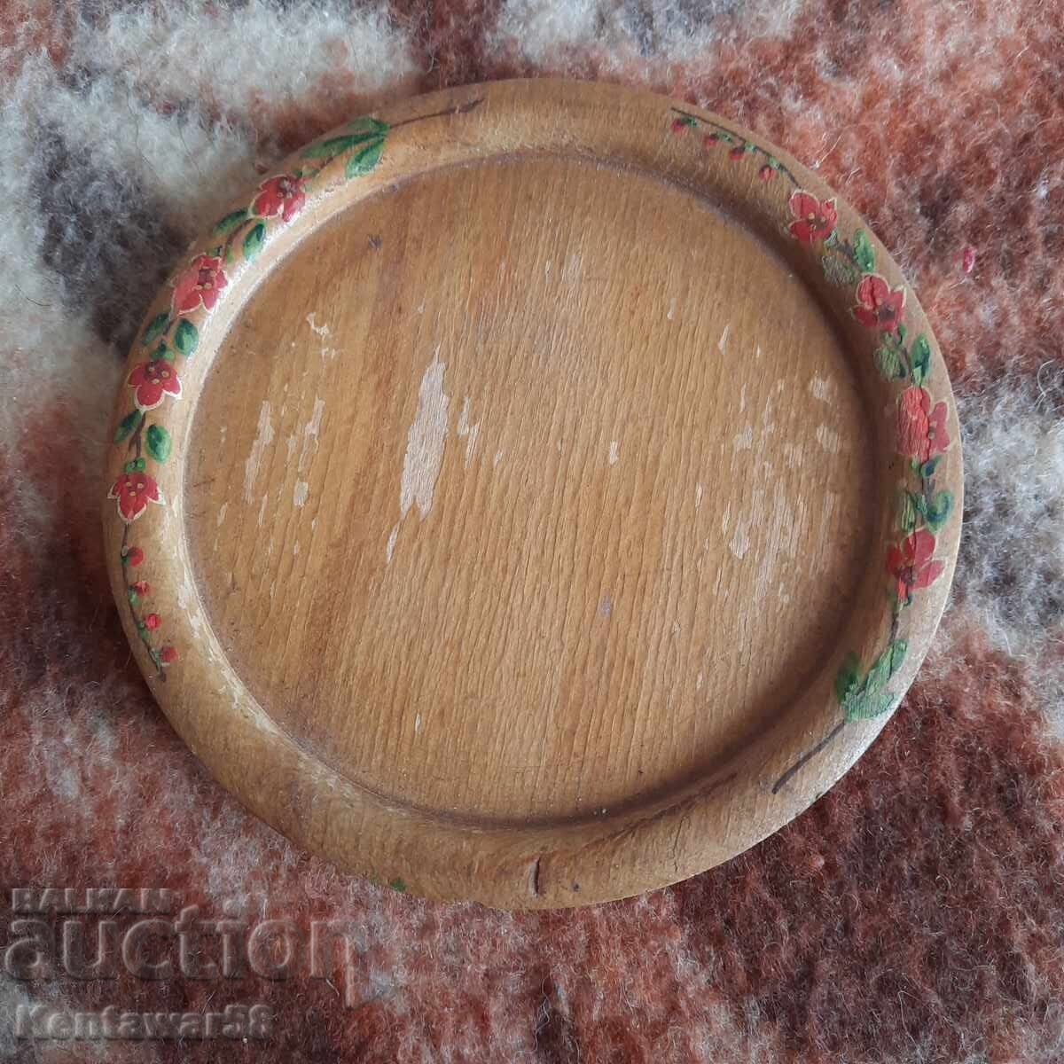 Wooden painted plate.