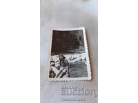 Photo Lovech Young girl on a dam over a river