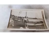 Photo Man and boy on a boat for walks in the sea No. 11