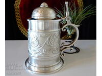 Pewter mug, ornaments, royal lily.