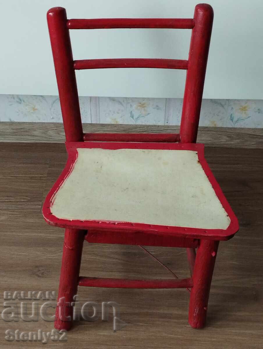 Old children's wooden four-legged stool