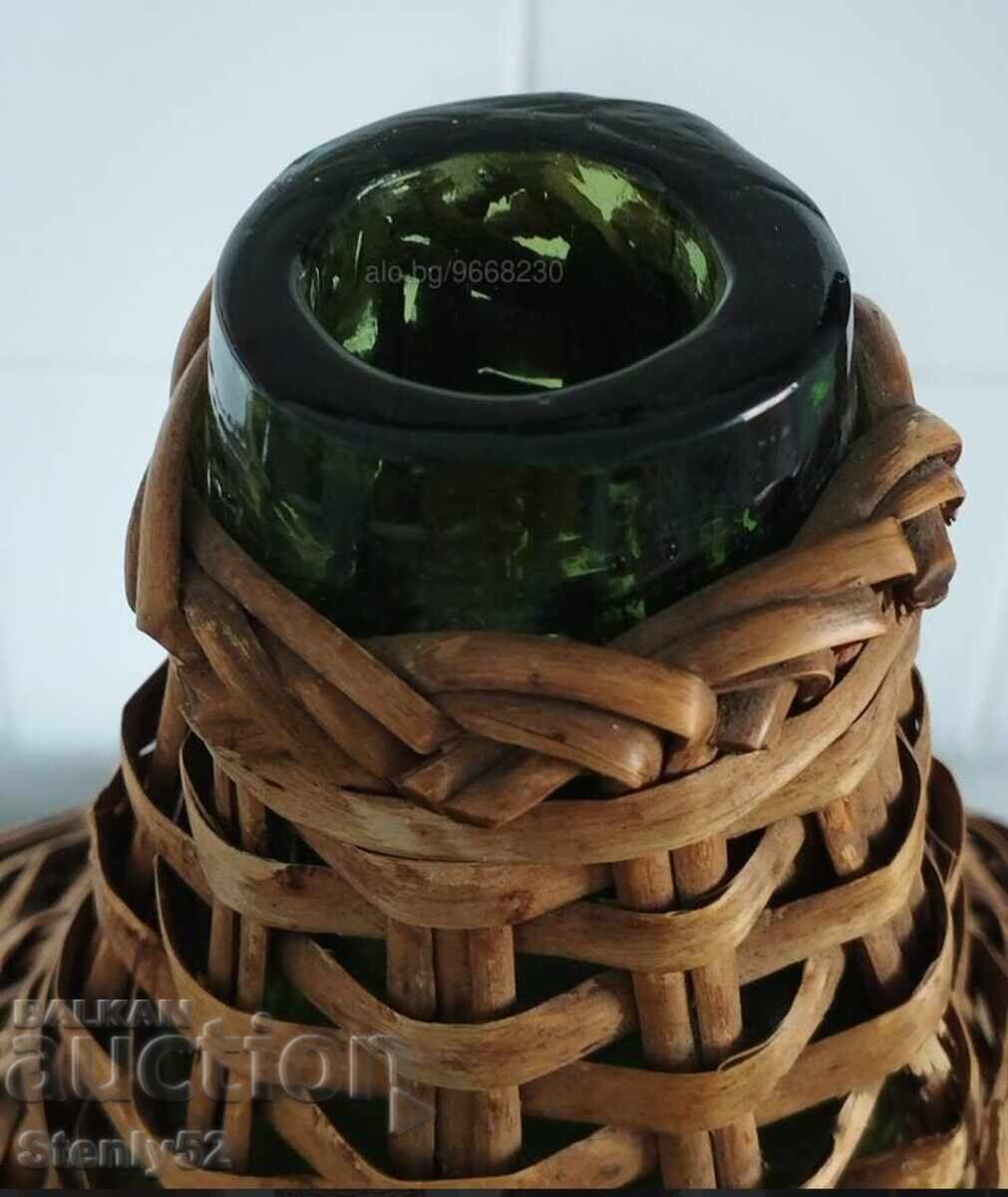 Auction  Old woven carboy, blown thick glass, 10 liters.