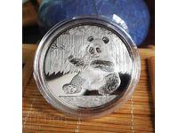 Panda coin in protective capsule, Panda with bamboo China