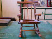 An old wooden children's toy - a rocking chair