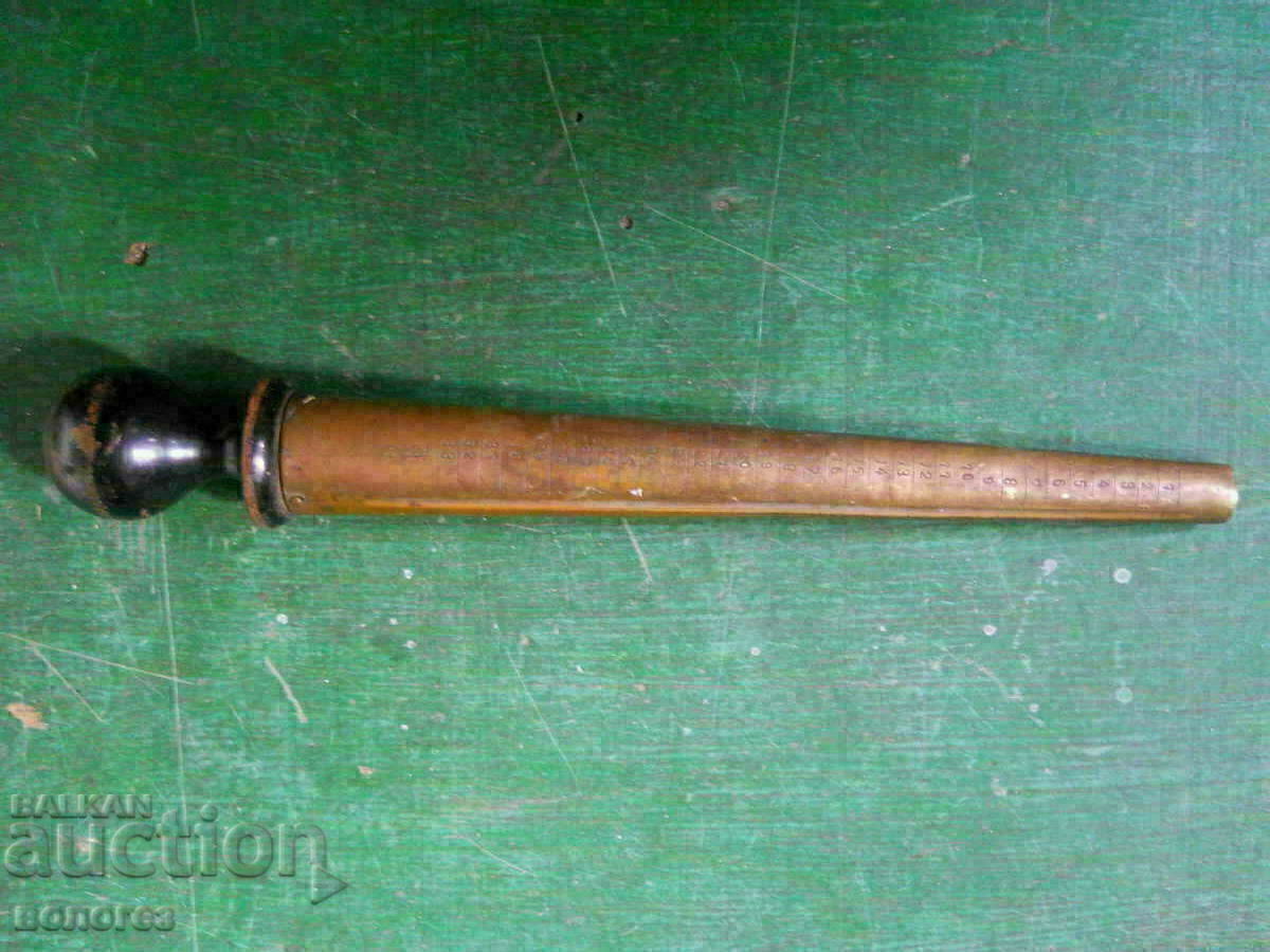 Old wooden jeweler measuring cone for rings