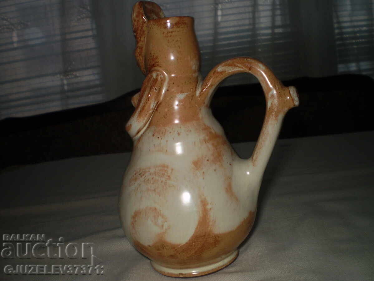 Auction Folk art ceramic pitcher with a woman's face Auction Folk art ceramic pitcher with a woman's face