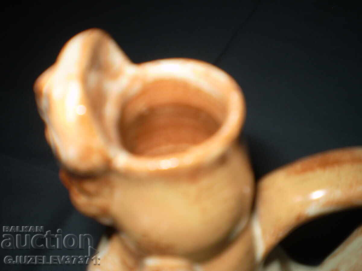 Delivery of Folk art ceramic pitcher with a woman's face Delivery of Folk art ceramic pitcher with a woman's face