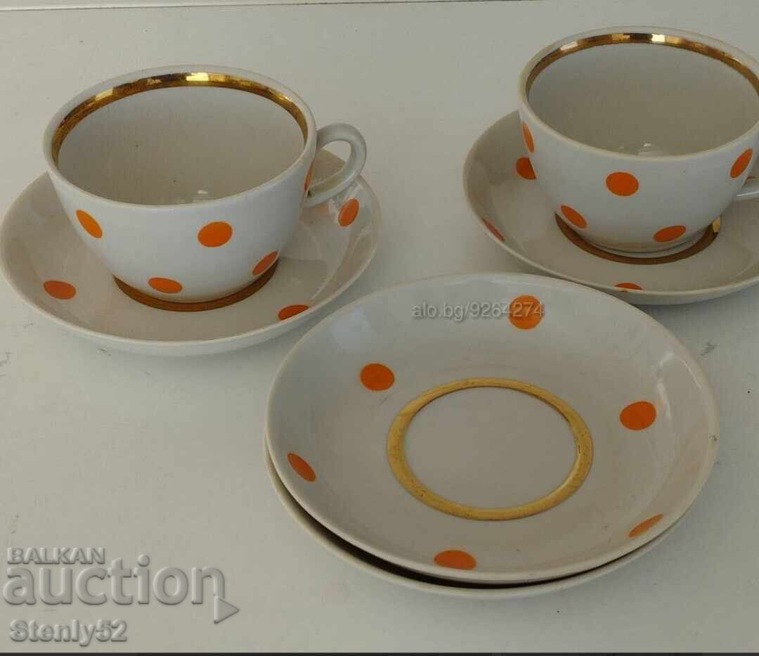 Russian Sotsa porcelain 2 cups + 4 plates with gilded edges. Russian Sotsa porcelain 2 cups + 4 plates with gilded edges.