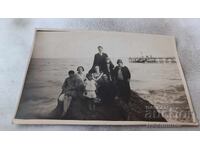 Photo Varna Men and women on a rock by the sea