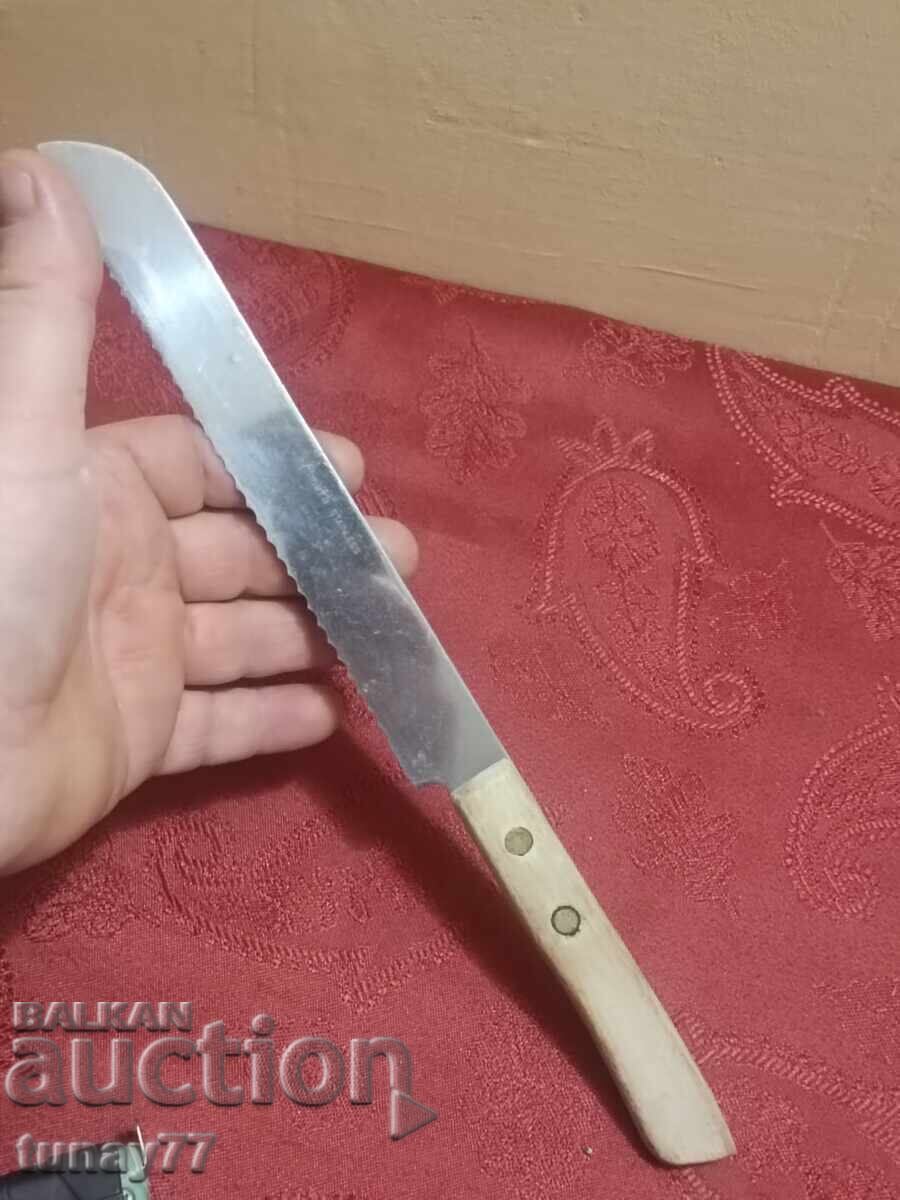 Solid kitchen knife with markings, wooden handle