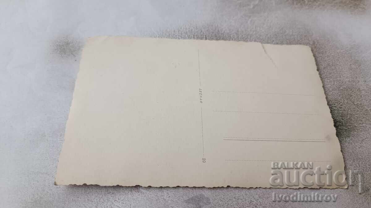 Photo Varna Woman walking past ANTIQUE STORE with price 3.45 BGN | € 1.76