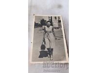 Photo Varna Woman walking past ANTIQUE STORE