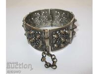 Old women's bracelet with ornaments costume jewelry