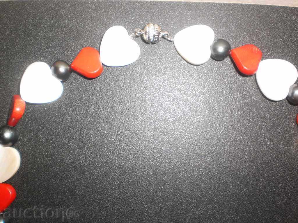 Delivery of Heart-shaped red coral and mother-of-pearl necklace with pearls Delivery of Heart-shaped red coral and mother-of-pearl necklace with pearls