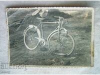 Old photo of a broken bicycle, wheel