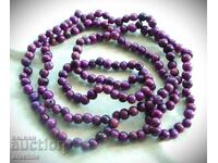 Long necklace made of royal-colored sugilite stone